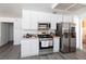 Modern kitchen featuring stainless steel appliances and white cabinetry at 459 Kelsford Dr, Las Vegas, NV 89123