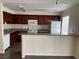 Well-equipped kitchen with granite countertops and wood cabinets at 5427 Indian River Dr # 418, Las Vegas, NV 89103