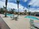 Community pool area with lounge chairs and tables at 5427 Indian River Dr # 418, Las Vegas, NV 89103