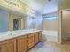 Bathroom with double vanity, soaking tub, and tile floors at 5905 Reflection Point Ct, Las Vegas, NV 89110