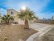 Front exterior of the two-story home with palm trees and a driveway at 5905 Reflection Point Ct, Las Vegas, NV 89110