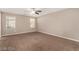 Bright bedroom with neutral walls, carpet, and a ceiling fan at 6972 Placid Lake Ave, Las Vegas, NV 89179