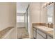 Bathroom with granite countertop and mirrored vanity at 6981 Wedgewood Way, Las Vegas, NV 89147