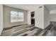 Dining room featuring wood-look flooring and a view of the backyard at 6981 Wedgewood Way, Las Vegas, NV 89147