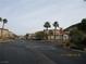 Residential street view with houses and palm trees at 716 Solitude Point Ave, Henderson, NV 89012