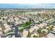 Aerial view of community with pool, parking, and landscaping at 7944 Diamond Rock Way # 202, Las Vegas, NV 89128