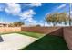 Small backyard with artificial turf and concrete patio at 8412 Wildheart Ranch St, Las Vegas, NV 89131