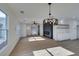 Open concept dining room with modern fireplace and kitchen at 8412 Wildheart Ranch St, Las Vegas, NV 89131