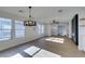 Bright dining area with hardwood floors and modern chandelier at 8412 Wildheart Ranch St, Las Vegas, NV 89131