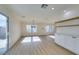 Bright dining room with light wood floors and large windows at 8412 Wildheart Ranch St, Las Vegas, NV 89131