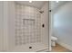 Modern shower with patterned tile and frameless glass enclosure at 8412 Wildheart Ranch St, Las Vegas, NV 89131