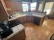 Full view of kitchen with wood cabinets, tile countertops, and appliances at , Henderson, NV 89074