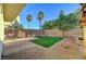 Spacious backyard with a patio and artificial turf at 10147 Dragons Meadow Ct, Las Vegas, NV 89148