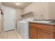 Laundry room with washer, dryer, and utility sink at 11519 Via Princessa Ct, Las Vegas, NV 89138