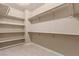 Spacious walk-in closet with built-in shelves and hanging rods at 11519 Via Princessa Ct, Las Vegas, NV 89138