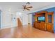 Bright entryway with hardwood floors, wooden staircase, and white door at 1428 Bellglen Dr, Las Vegas, NV 89128