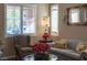 Living room with hardwood floors, window shutters, and seating at 1825 Spring Summit Ln, Las Vegas, NV 89134