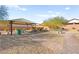 Community gazebo with picnic table and benches in a gravel and grassy area at 4133 Fairywren Dr, North Las Vegas, NV 89031