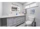 Modern bathroom with double vanity, walk-in shower, and toilet at 4261 El Moor Way, Las Vegas, NV 89121