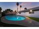 Relax and cool off in this inviting kidney-shaped swimming pool at 4261 El Moor Way, Las Vegas, NV 89121