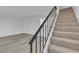 Modern staircase with metal railing leading to the upper level at 5383 Mountain Vista St # 5, Las Vegas, NV 89120