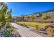 Brick pathway in a community with landscaping at 5407 Zacatin Ct, Las Vegas, NV 89166