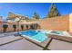 Inviting pool and spa area with a convenient umbrella for shade at 5407 Zacatin Ct, Las Vegas, NV 89166