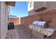 Backyard with grill and seating area at 6250 Buffalo Spring Ct, Las Vegas, NV 89122