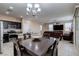 Open concept dining area adjacent to kitchen and living room at 6250 Buffalo Spring Ct, Las Vegas, NV 89122