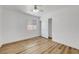 Bright bedroom with wood-look floors and ceiling fan at 6543 Stormy Sky Ave, Las Vegas, NV 89110