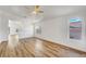 Spacious living room with wood floors and ceiling fan at 6543 Stormy Sky Ave, Las Vegas, NV 89110