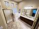 Bathroom with walk-in shower, soaking tub, and double vanity at 7452 Desert Flame Ct, Las Vegas, NV 89149