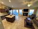 Open living room with a fireplace, comfortable seating, and access to the patio at 7452 Desert Flame Ct, Las Vegas, NV 89149