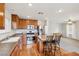 Spacious kitchen with island, stainless steel appliances, and wood cabinets at 7822 Shingle Beach St, Las Vegas, NV 89166