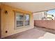 Covered patio with concrete flooring and adjacent backyard at 7822 Shingle Beach St, Las Vegas, NV 89166