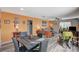 Dining room features a dark wood table, gray chairs and view of the living room at 1829 Sweeney Ave, Las Vegas, NV 89104