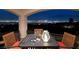 Night view from a private balcony, featuring a table for two and breathtaking cityscape at 2781 Josephine Dr, Henderson, NV 89044