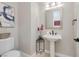 Elegant powder room with pedestal sink and modern fixtures at 2781 Josephine Dr, Henderson, NV 89044