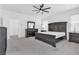 Main bedroom with king-size bed, dresser, and ceiling fan at 2970 Gunnery Forge St, Las Vegas, NV 89156