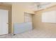 Bedroom with tile floors, ceiling fan, closet, and exterior door at 304 S Buffalo Dr # 201, Las Vegas, NV 89145