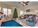 Gathering room with a brown sectional sofa and a Christmas tree at 3336 N Campbell Rd, Las Vegas, NV 89129