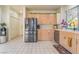 Bright kitchen with stainless steel appliances and light wood cabinets at 5058 Crooked Stick Way, Las Vegas, NV 89113