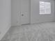 Empty bedroom with carpet and simple white door at 522 Riley Ridge Ct, Henderson, NV 89012