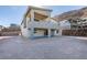 Modern two-story home with a balcony and desert landscaping at 522 Riley Ridge Ct, Henderson, NV 89012