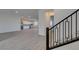 Modern staircase with black metal railing at 522 Riley Ridge Ct, Henderson, NV 89012