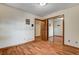 Bedroom with mirrored closet doors and wood flooring at 5423 Arturo Ct, Las Vegas, NV 89120