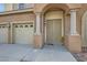 Front entrance with double doors, columns and sunflower decor at 5819 Casa Madera Ct, Las Vegas, NV 89131