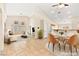 Virtually staged dining area with adjacent living room and kitchen at 6101 Pahoehoe Way, North Las Vegas, NV 89031