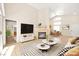 Virtually staged living room featuring a fireplace and open floor plan at 6101 Pahoehoe Way, North Las Vegas, NV 89031