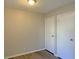 Simple bedroom with light walls, wood-look floors, and double closets at 7054 Burcot Ave # J43, Las Vegas, NV 89156